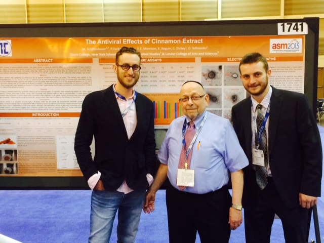 NYSCAS biology professor Dr. Milton Schiffenbauer (middle) with students Oleg Yefimenko (right) and Yehudah Morrison (left), presenting their research at the American Society for Microbiology Annual Meeting in New Orleans.
