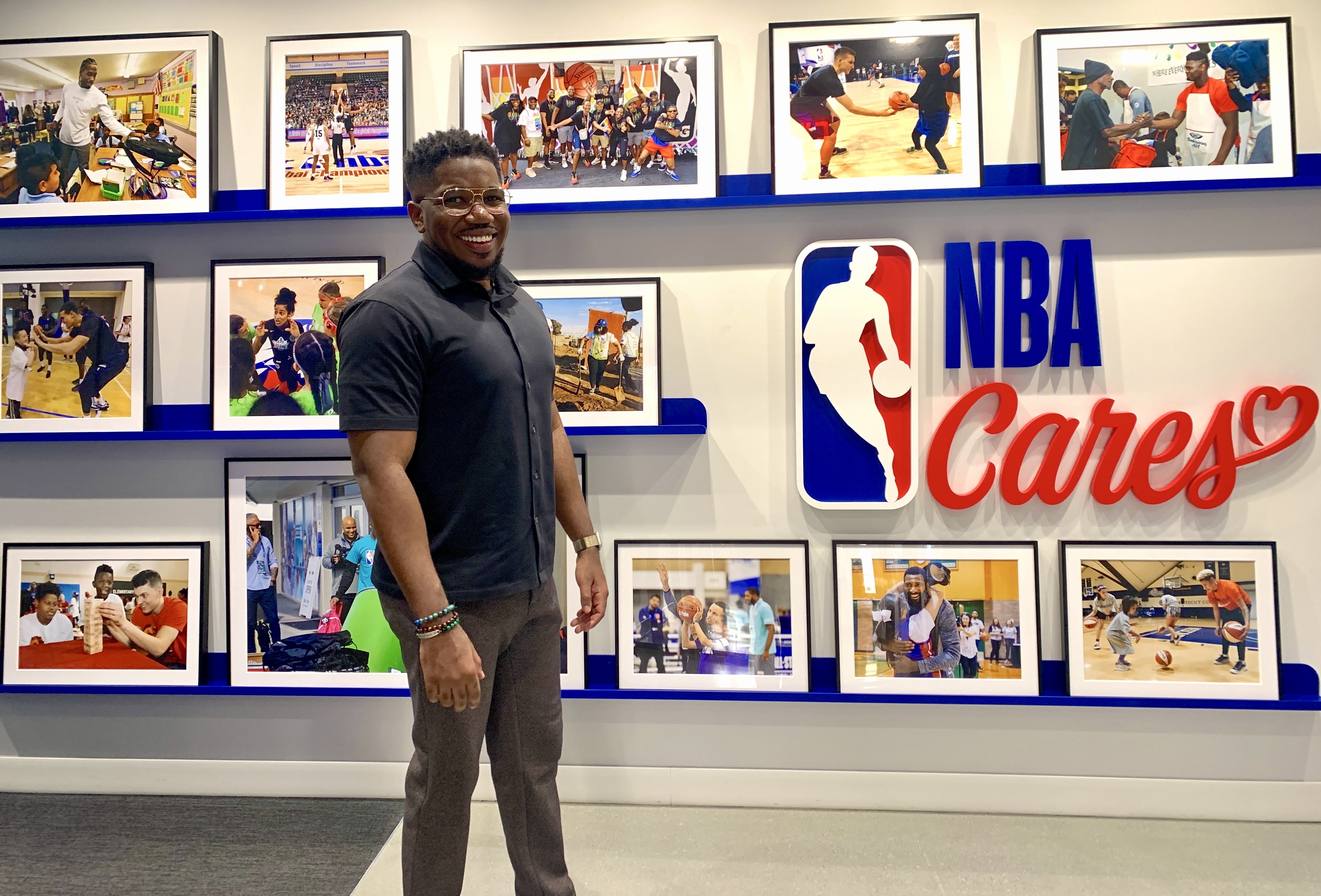 Jade Daniels in front of an NBA Cares sign and photos of NBA youth initiatives