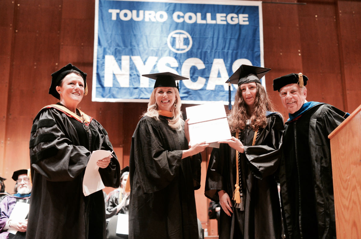 Emmy-award-winning journalist Rita Cosby served as the graduation speaker for the New York School of Career and Applied Studies (NYSCAS) and was honored with the establishment of the Rita Cosby Award presented to Guendalina Almici. From left: Eva Spinelli-Sexter, vice president and executive administrative dean of NYSCAS; Cosby; Almici; Leon Perkal, NYSCAS associate dean of faculties.