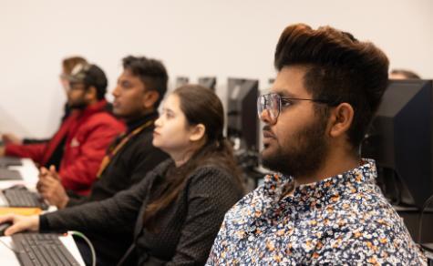 diverse group of students working in computer lab