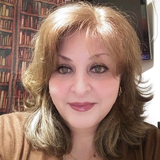 A headshot of professor Joann Median