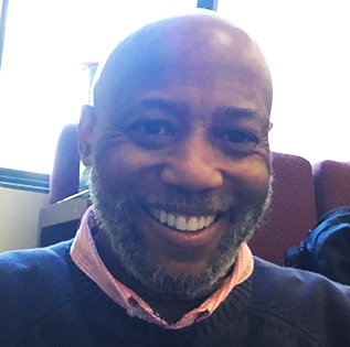 A headshot of professor Albert White
